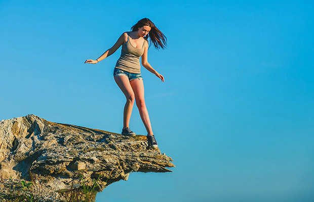 bigstock-acrophobia-woman-tall-stands-o-47727874