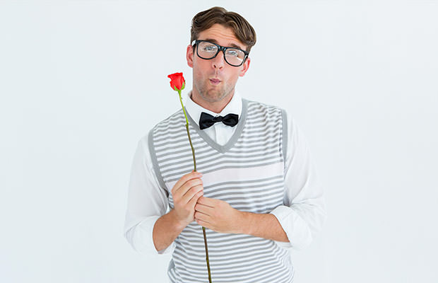 bigstock-Geeky-hipster-holding-a-red-ro-855753862