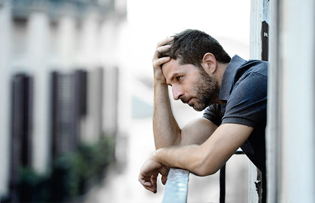 bigstock-Young-Man-At-Balcony-In-Depres-71305003