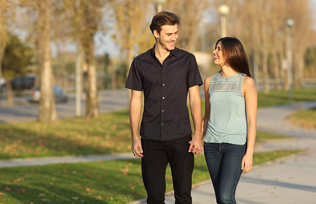 bigstock-Couple-Taking-A-Walk-In-A-Park-86635433