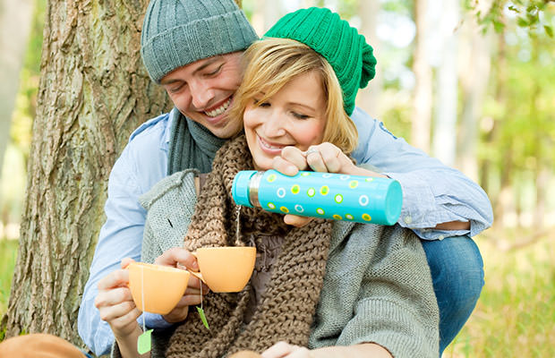 bigstock-Happy-couple-in-nature-drinkin-19420898